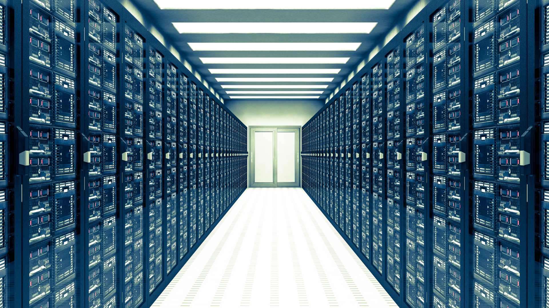Interior view of a modern data center with rows of server racks extending into the distance