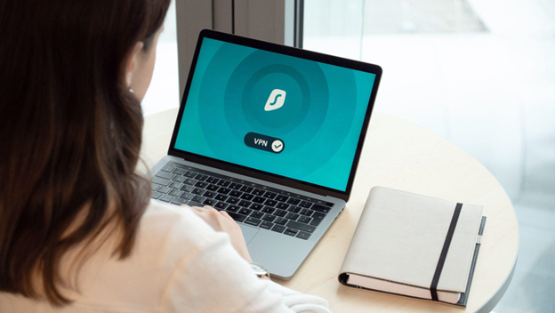 Woman connecting to a VPN on her laptop